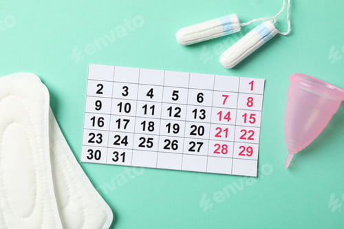 Preview: Menstruation period concept on mint background, top view