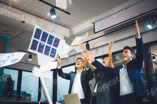 Preview: Group of business people rejoicing in closing the quarter successfully tossing up paper documents
