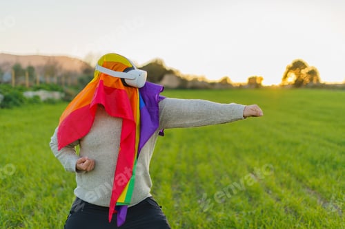 Preview: Adult Wearing VR Headset Outdoors With Rainbow Flag