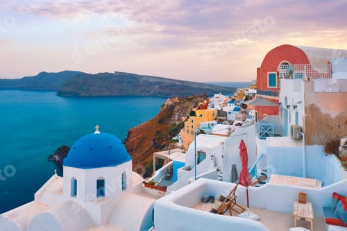 Preview: Famous view from viewpoint of Santorini Oia village with blue dome of greek orthodox Christian