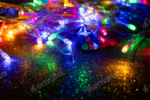 Preview: colorful Christmas lights on dark glitter background