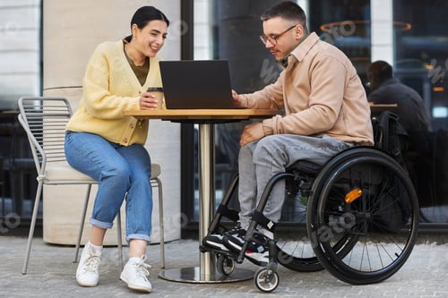 Preview: Man with disability having business meeting