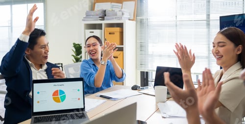 Preview: Asian employees congratulating for achievement with applause in modern office