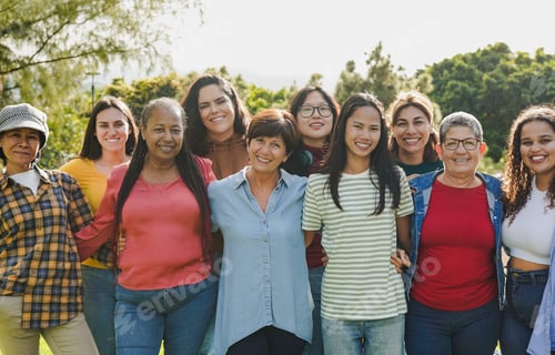 Preview: Group of multi generational women hugging each other while smiling on camera