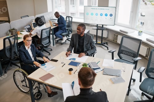 Preview: Female Manager using Wheelchair in Meeting