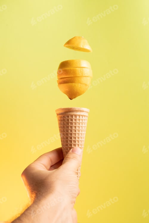 Preview: A man holds corn in his hand with a floating lemon over it