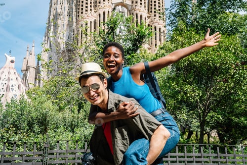 Preview: Afro woman piggybacking a friends while visiting a modernist Church