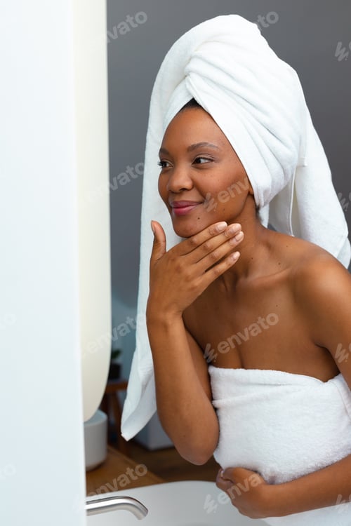 Preview: Relaxed Woman Wearing Towel in Bathroom
