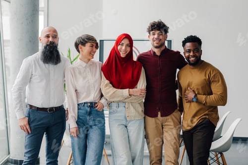 Preview: Startup business team smiling together in modern office