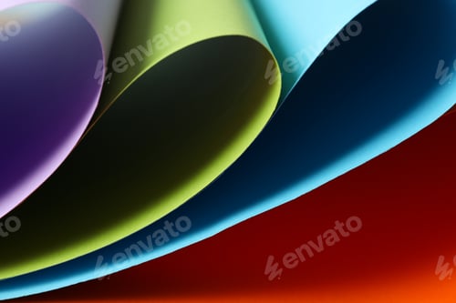 Preview: Color sheets on orange background, close up. Abstract background