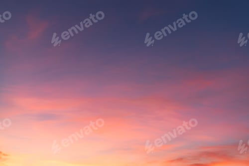 Preview: Beautiful shot of pink clouds in a clear blue sky with a scenery of sunrise