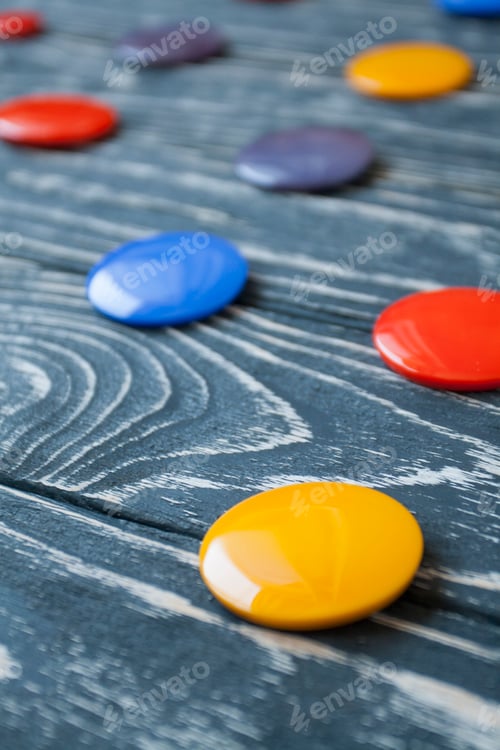 Preview: A set of colorful glass buttons for clothes on a dark wooden background