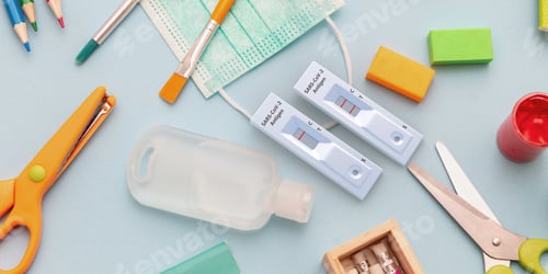 Preview: Coronavirus spread prevention measure at school. Rapid test, mask, disinfection gel and stationery