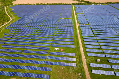 Preview: Aerial view of big sustainable electric power plant with many rows of solar photovoltaic