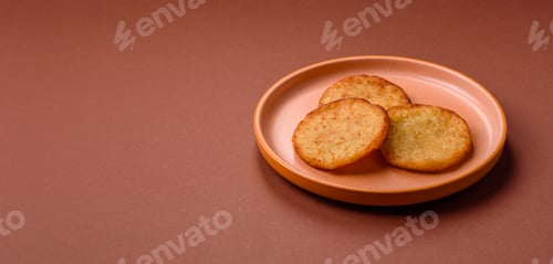 Preview: Hash browns, a breakfast food made of potatoes, onions and vegetables. Hash browns with potatoes