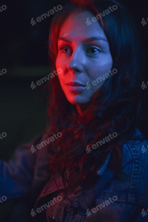 Preview: Beautiful woman in red and blue neon lights