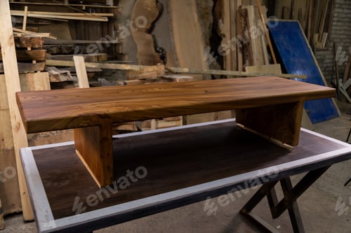 Preview: Newly-made brown wooden table in the workshop