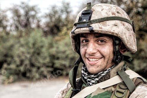 Preview: Portrait of smiling army soldier in ragged helmet