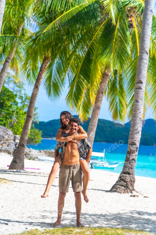 Preview: Couple enjoying tropical vacation on malcapuya island, philippines