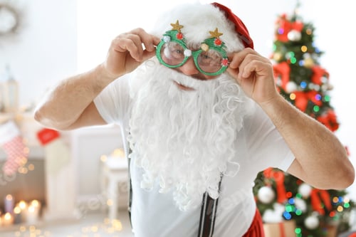 Preview: Authentic Santa Claus with funny glasses indoors