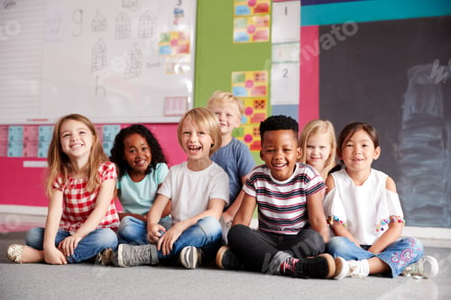 Preview: Portrait Of Elementary School Pupils Sitting On Floor In Classroom