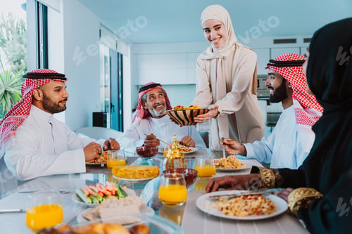 Preview: Arab family enjoying traditional meal together during ramadan