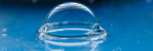 Preview: soap bubble close up. abstract blue water background. banner