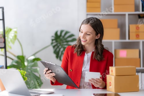 Preview: Female ecommerce business owner prepares package box for customer and delivery check balance. SME.