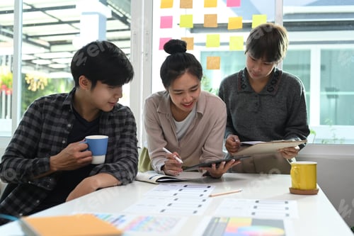 Preview: Group of young Asian creative designer brainstorming and discussing on new project at office.