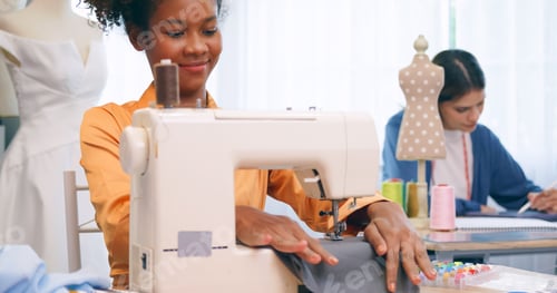 Preview: A group of young women are learning the profession of design and tailoring.