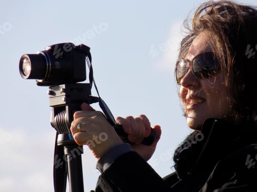 Preview: Portrait of a woman with a camera