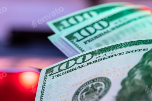 Preview: money background from dollars in neon light, close up