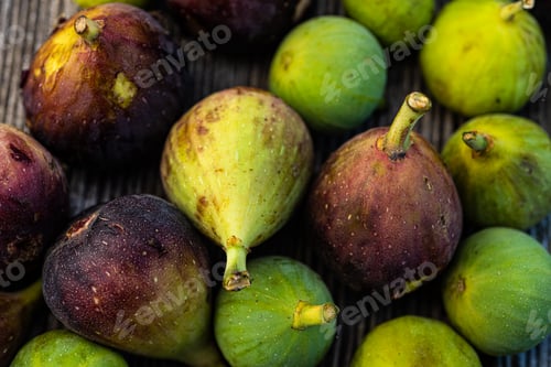 Preview: Fresh Colorful Figs Gathered on Wooden Background