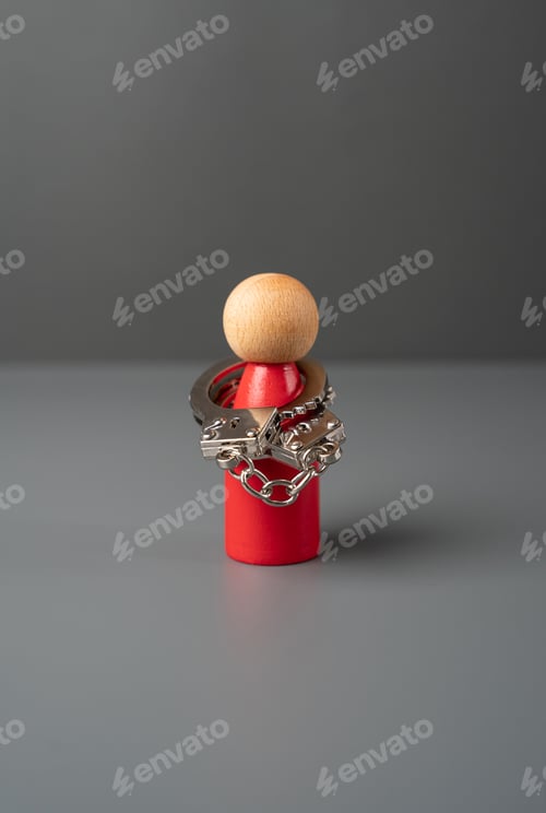 Preview: Man figurine in handcuffs. Mental health.