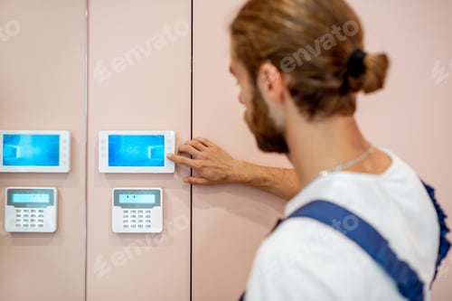 Preview: Workman setting up the video on the intercom
