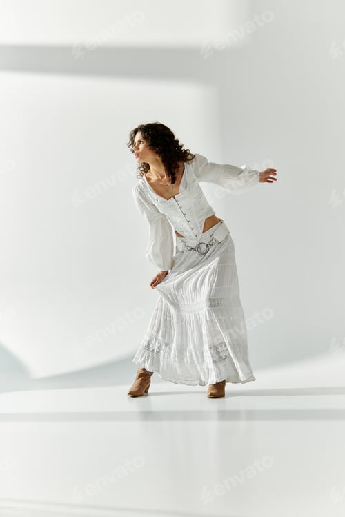 Preview: Young beautiful woman expressing elegance and style in a bright minimalist space