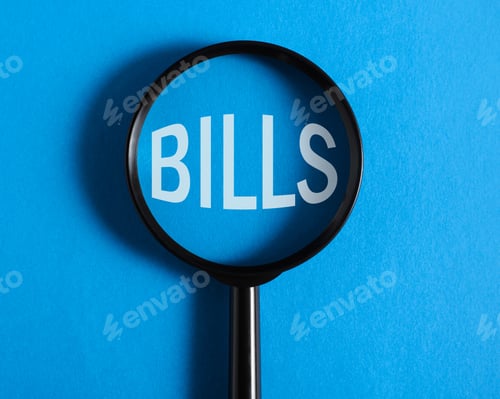 Preview: Financial, economic, tax rise concept. Magnifying glass focused on big word Bills on blue background