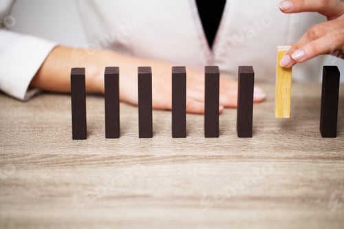 Preview: Business concept, woman's hands make up wooden cubes symbolizing the success of the company
