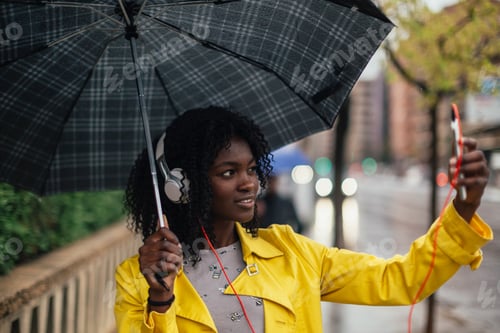 Preview: Young black girl with umbrella