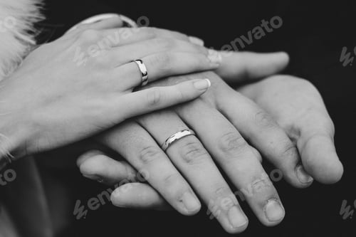 Preview: bride and groom on a rainy wedding day walking