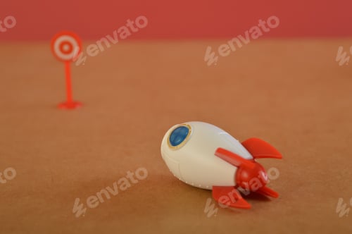 Preview: Toy rocket heading to the target. Concept of achieving your goal
