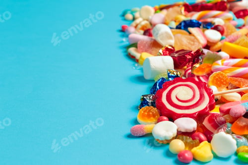 Preview: colored candies on blue background