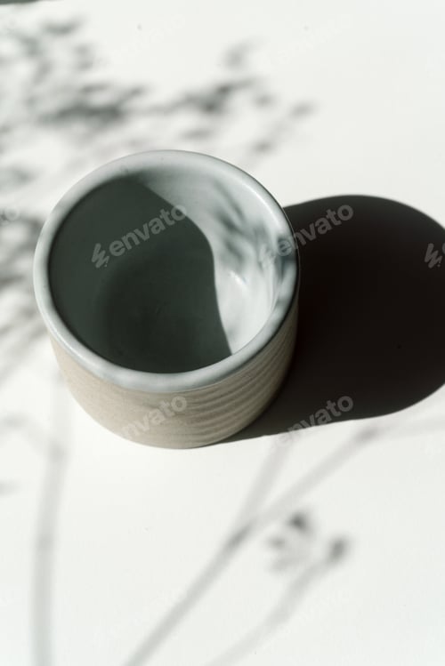Preview: Shadow from the flowers on the ceramic cup