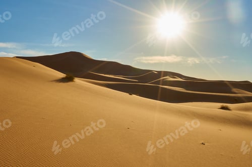 Preview: Sand dunes and blue sky with sun