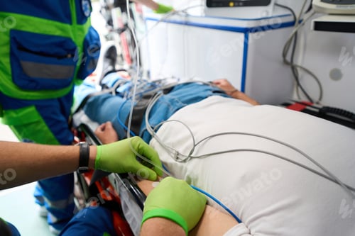 Preview: Medic connects a patient to a drip in an ambulance