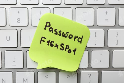 Preview: Paper note with password on keyboard, top view