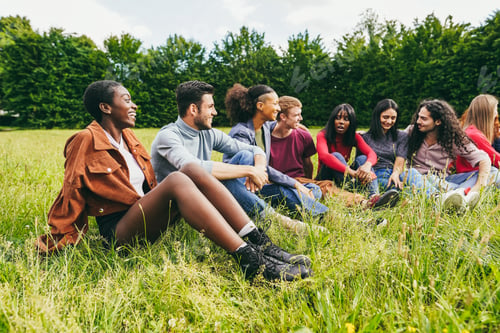 Preview: Multiracial young friends having fun outdoor - Soft focus on african girl face