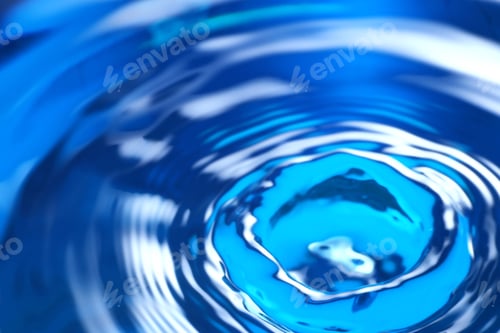 Preview: Splash of clear water on blue background, closeup