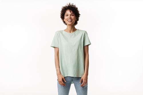 Preview: Young curly brunette woman laughing and looking at camera
