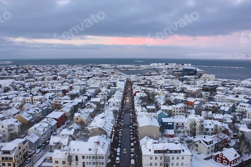 Preview: Looking down on Sunset over snow covered reykjavik
